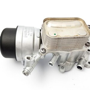 Engine coil cooler housing